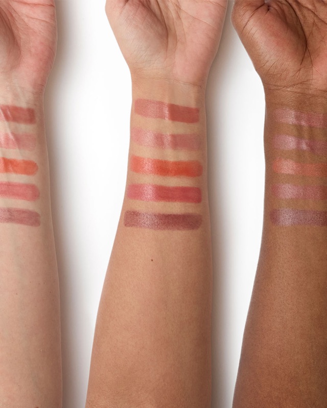 Lipstick swatches on three skin tones